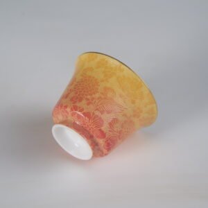 Side floral view of autumn glow porcelain horseshoe cup showing red to yellow gradient