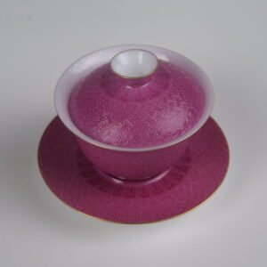 Top-angle view of the Carmine Red Elegant Charm Gaiwan full set, showcasing its lid and saucer with vibrant rose-red rouge glaze, fine gold rim accents, and strictly symmetrical geometric Swastika Pa Hua pattern
