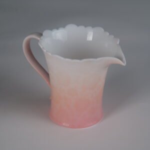 Right side view of cherry blossom pink gradient fair pitcher with spout and handle