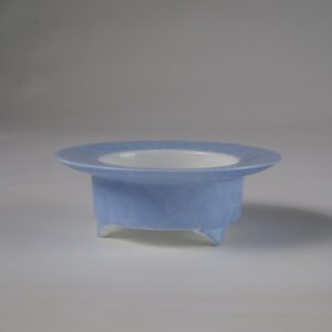 Side view of light blue three-legged ceramic incense burner without lid