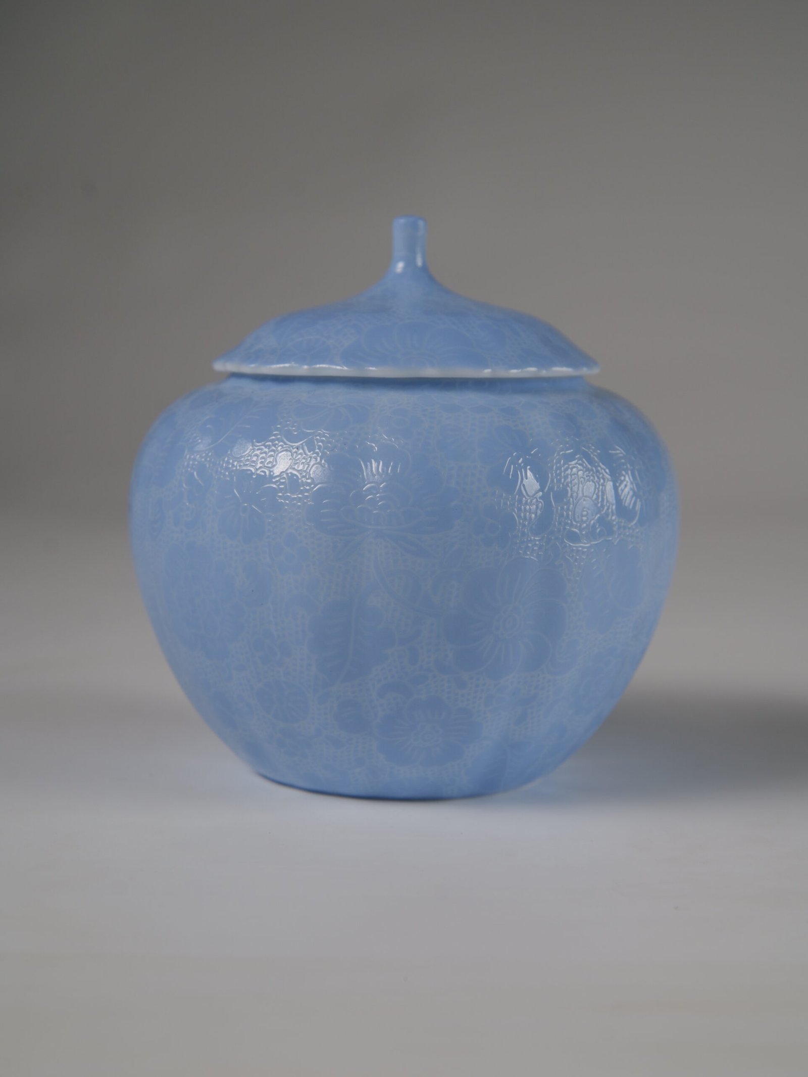 East Breaking Dawn Melon Jar - Front Profile Eye level front view of east breaking dawn blue melon-shaped jar with hundred flowers pattern