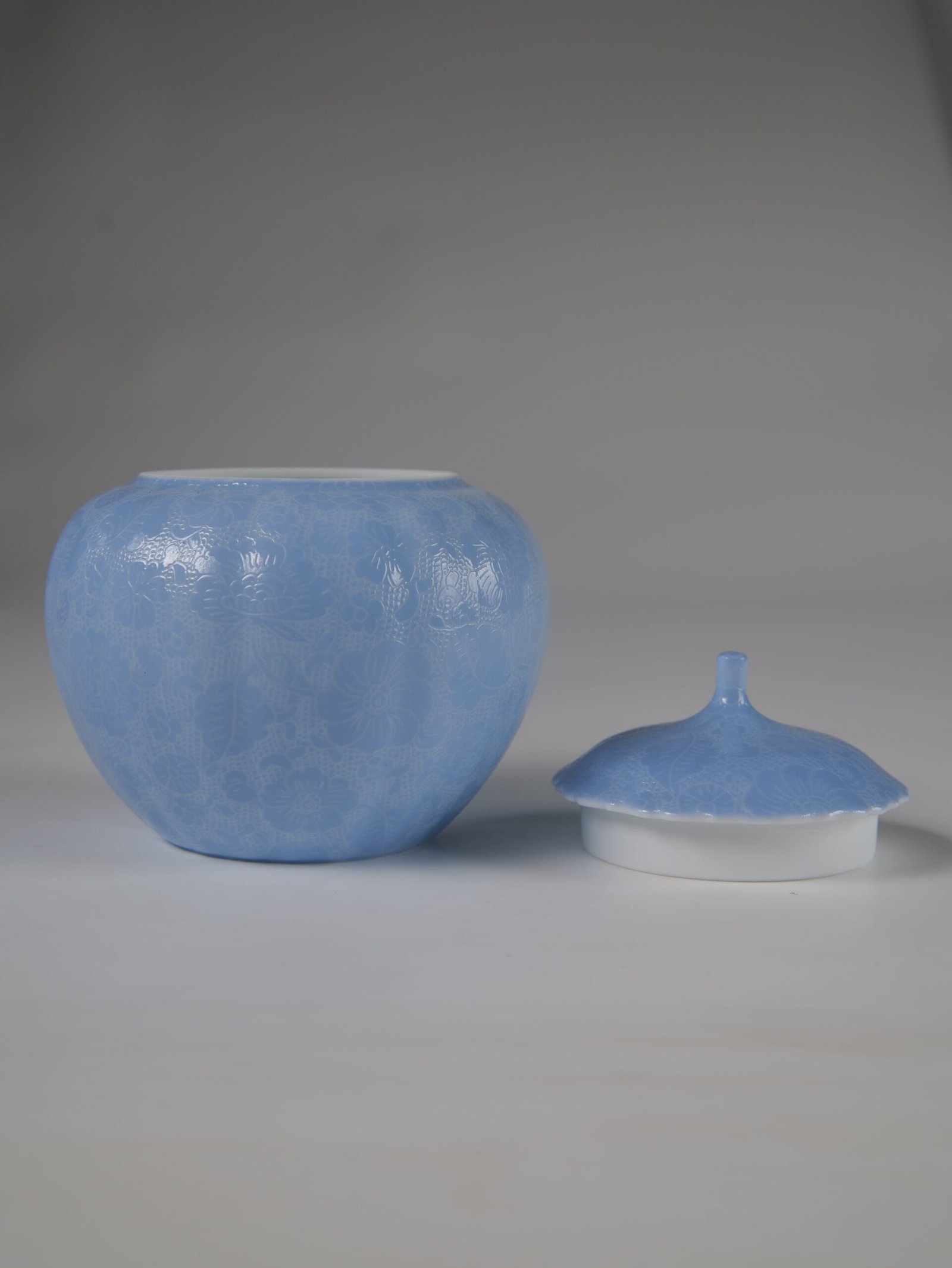 East Breaking Dawn Melon Jar – Open Lid View Front view of open east breaking dawn blue melon jar next to porcelain lid