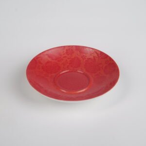 Top-angle view of the saucer from the Gold-base Vermilion Horseshoe Gaiwan set, showing its rich royal vermilion red glaze on gold base with fine engraved Pa Hua daylily patterns