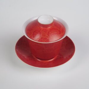 Top-angle view of the Gold-base Vermilion Horseshoe Gaiwan showcasing its lid, cup, and saucer with rich royal vermilion red glaze on gold base and fine engraved Pa Hua daylily patterns