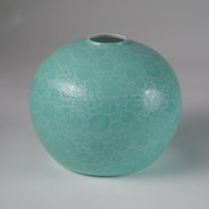 Bottom view showing white inner rim and carved texture of turquoise lampshade