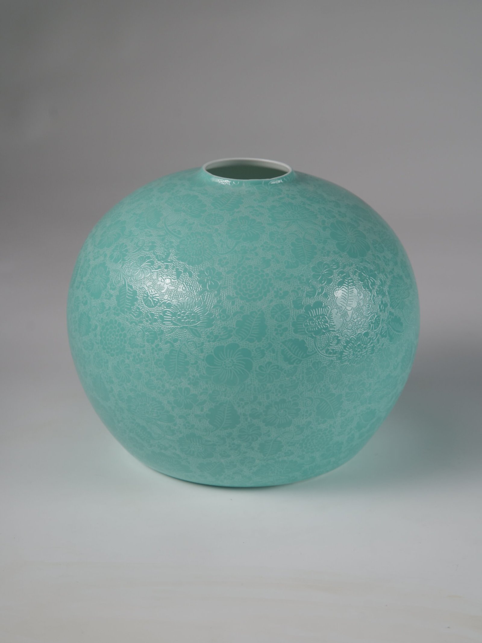 Treasure Jar Lampshade – Base Detail Bottom view showing white inner rim and carved texture of turquoise lampshade