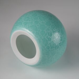 Top down view of turquoise green carved porcelain lampshade with top opening