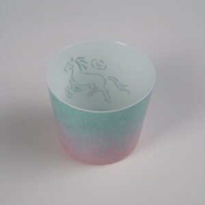 High angle interior view of porcelain cup showing hand-painted green horse motif