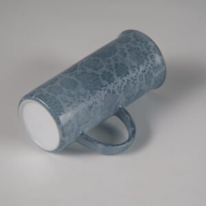 Tilted view of lunar gray porcelain aroma cup showing smooth base and body