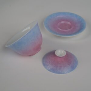 Disassembled view of the Midsummer Dream Gradient Elegant Charm Gaiwan showing the lid, cup, and saucer set separately, highlighting the soft pale purple and pink gradient glaze and handcrafted Pa Hua Hundred Flowers pattern