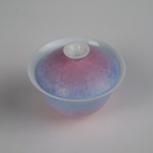 Top-angle view of the Midsummer Dream Gradient Elegant Charm Gaiwan without saucer, showing its lid and cup with a soft gradient blend of pale purple and pink glaze and handcrafted Pa Hua Hundred Flowers floral pattern