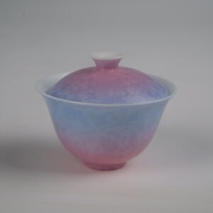 Side view of the Midsummer Dream Gradient Elegant Charm Gaiwan without saucer, showing its lid and cup with a soft gradient blend of pale purple and pink glaze and handcrafted Pa Hua Hundred Flowers floral pattern