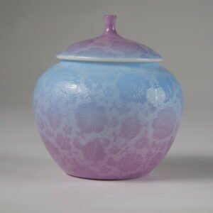 Eye level front view of misty lavender haze gradient melon-shaped jar with hundred flowers pattern