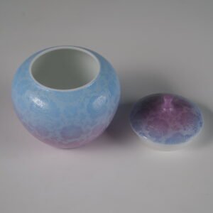 High angle view of open misty lavender haze melon jar showing white glazed interior