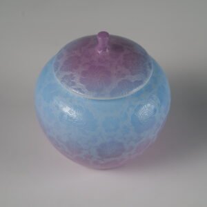 Top view of misty lavender haze gradient porcelain melon-shaped jar with lid