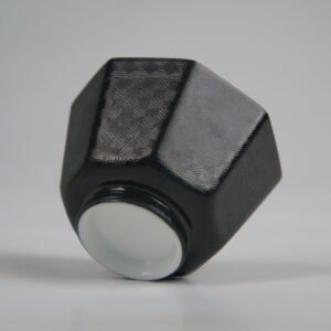 Bottom-up view of the Obsidian Black Octagonal porcelain cup showcasing its white base, geometric octagonal structure, deep obsidian black glaze, and fine engraved Pa Hua lattice patterns