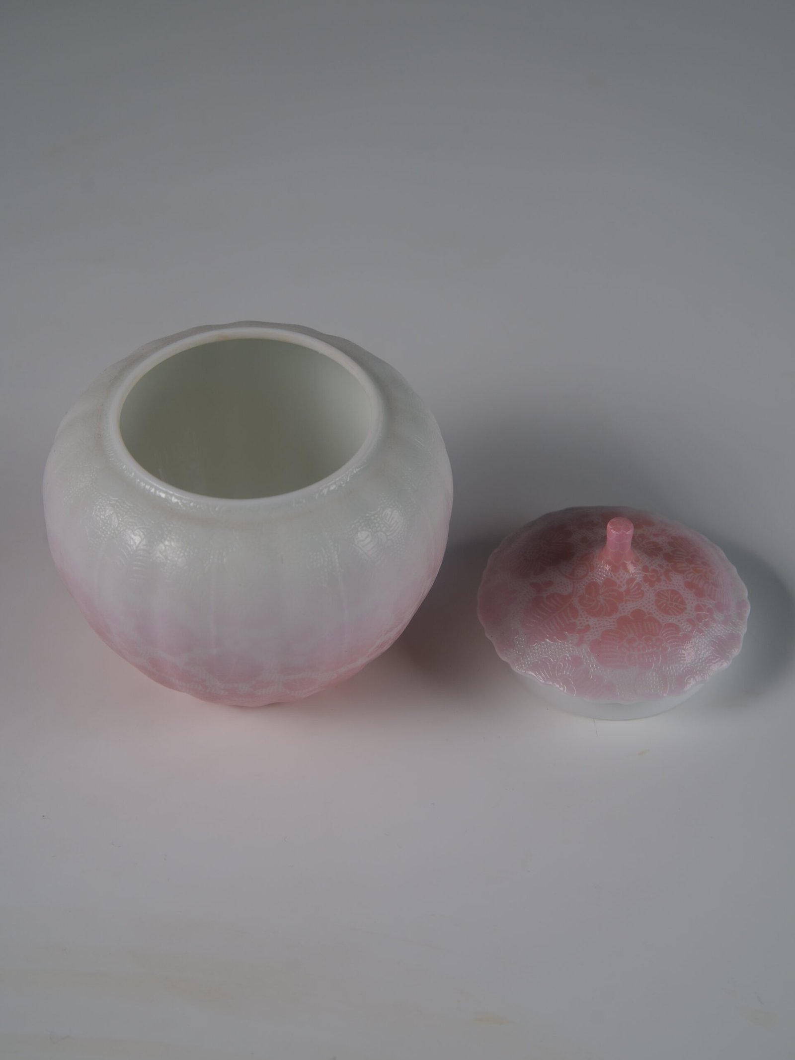 Peach Pink Gradient Melon Jar – Interior View High angle view of open peach pink melon jar showing white glazed interior