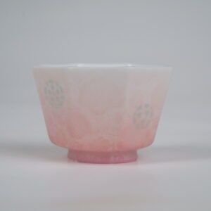 Front view of the Peach Pink Gradient Octagonal Glazed Linglong porcelain cup displaying its geometric octagonal shape, white-to-peach pink gradient glaze, and translucent rice-grain Linglong patterns
