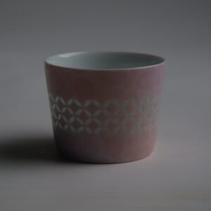Darkened back view of pink cup showing Linglong coin pattern