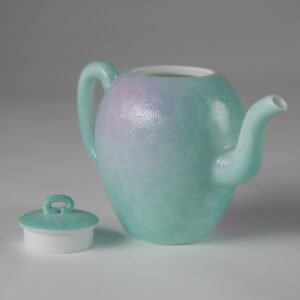 Side view of spring glow gradient porcelain beauty shoulder teapot with lid off on white background