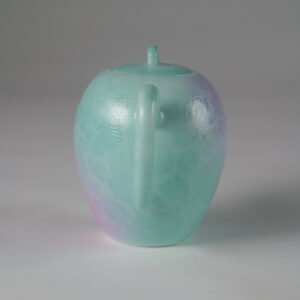 Eye-level rear view facing the handle of a spring glow gradient beauty shoulder porcelain teapot