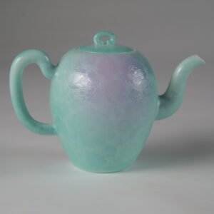 Eye-level side profile of spring glow gradient beauty shoulder teapot featuring hand-carved hundred flowers Pa Hua pattern