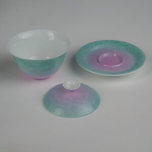 Disassembled view of the Spring Glow Gradient Elegant Charm Gaiwan showing the lid, cup, and saucer set separately, highlighting the soft pink and fresh green gradient glaze and handcrafted Pa Hua Hundred Flowers pattern
