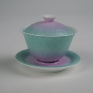 Side view of the complete Spring Glow Gradient Elegant Charm Gaiwan set, featuring a soft pink and fresh green gradient glaze on the lid, cup, and saucer with fine handcrafted Pa Hua Hundred Flowers floral pattern