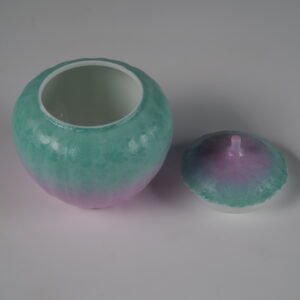 High angle view of open spring glow melon jar showing white glazed interior