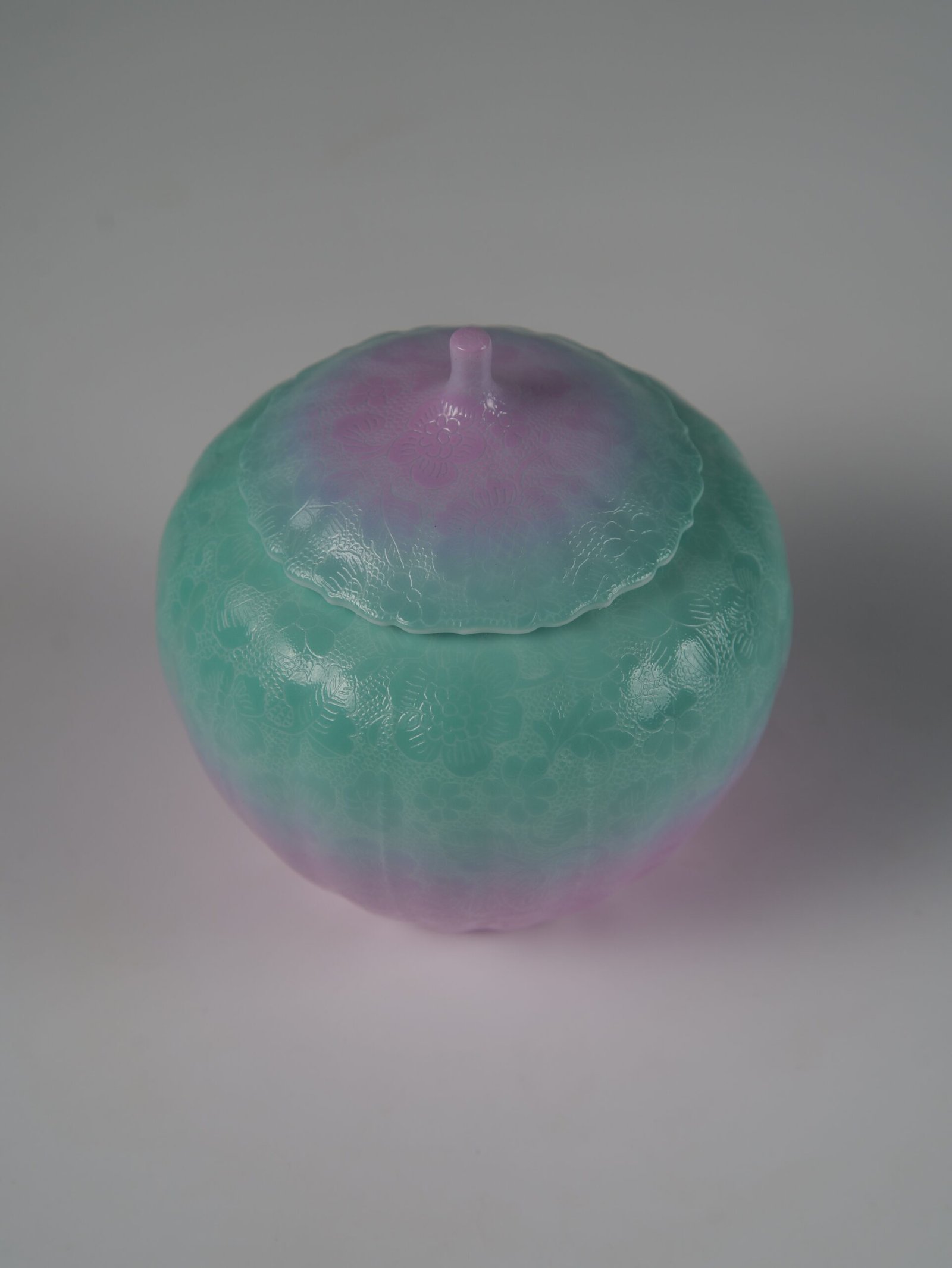 Spring Glow Gradient Melon Jar – Top Angle Top view of spring glow gradient porcelain melon-shaped jar with lid