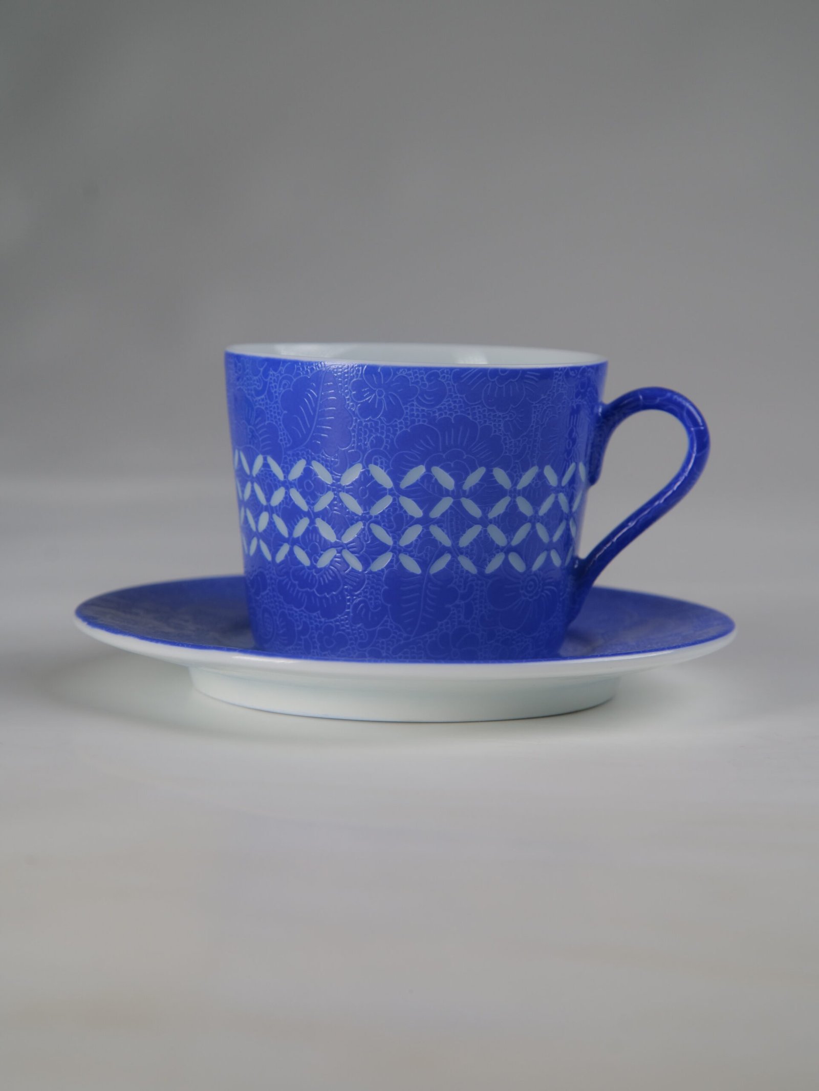 Ultramarine Coffee Cup - Set View Side view of ultramarine porcelain coffee cup with saucer