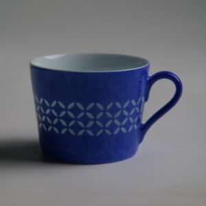 Ultramarine coffee cup showing translucent Linglong coin pattern