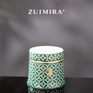 Front view of green rotatable ceramic cup featuring four-leaf clover motif