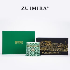 Green rotatable porcelain cup displayed with matching green and black gift packaging