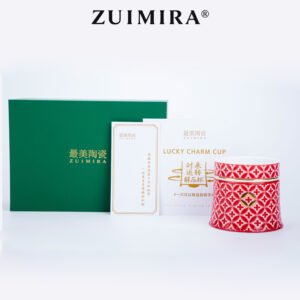 Red rotatable ceramic cup shown with green gift box and brand description cards